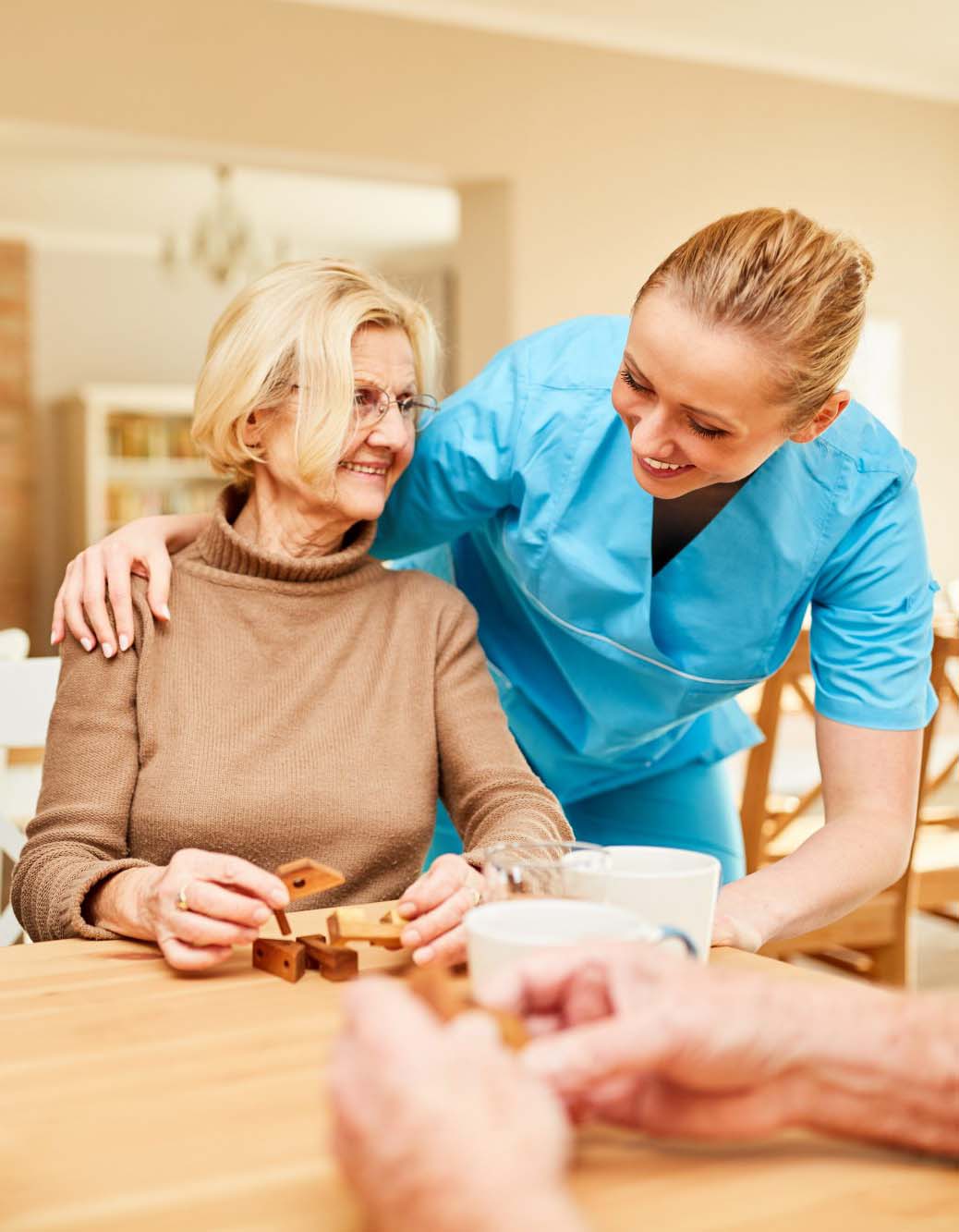 Compassionate healthcare professional supporting an older adult